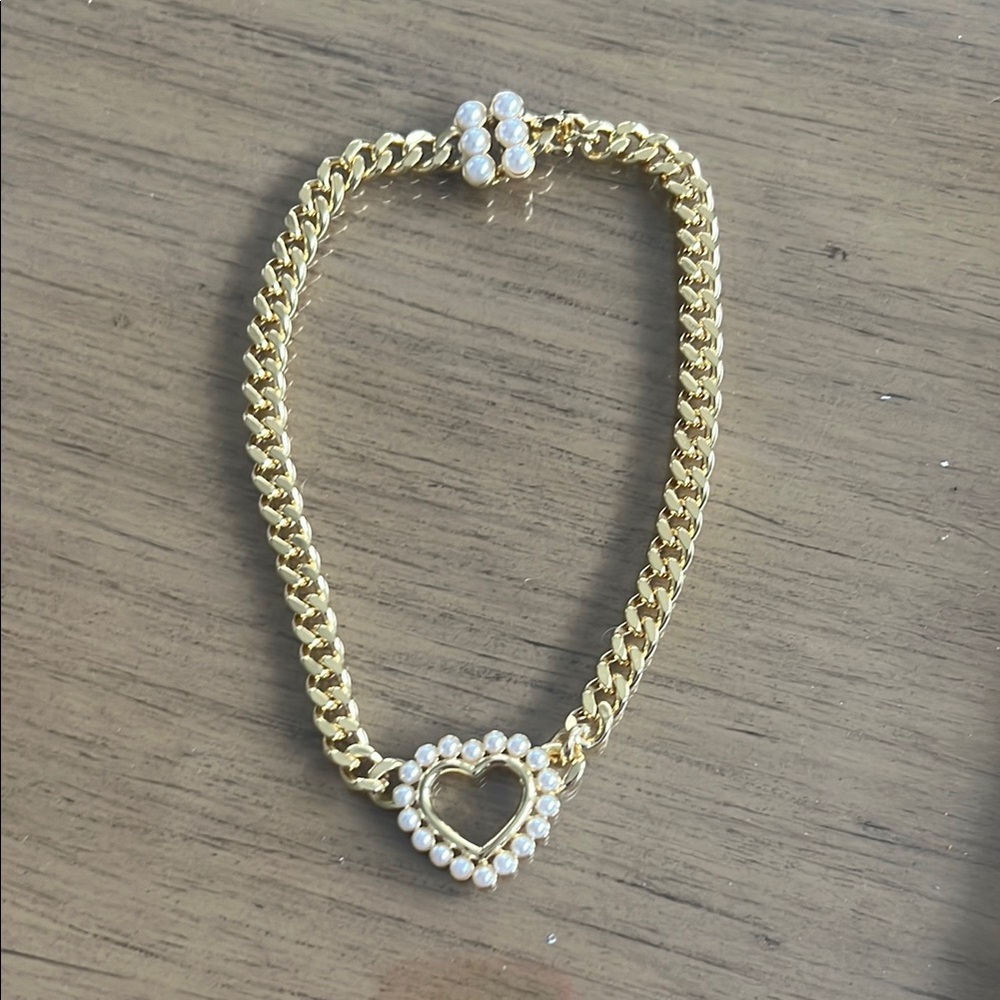 Celeste Starre gold and pearl choker necklace.